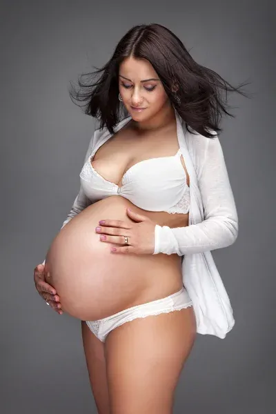 depositphotos_72662625-stock-photo-beautiful-young-pregnant-woman-retouched