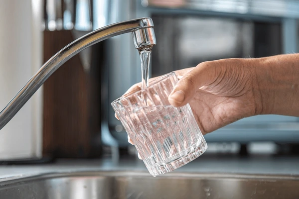 closeup-glass-being-filled-tap-600nw-2485393435