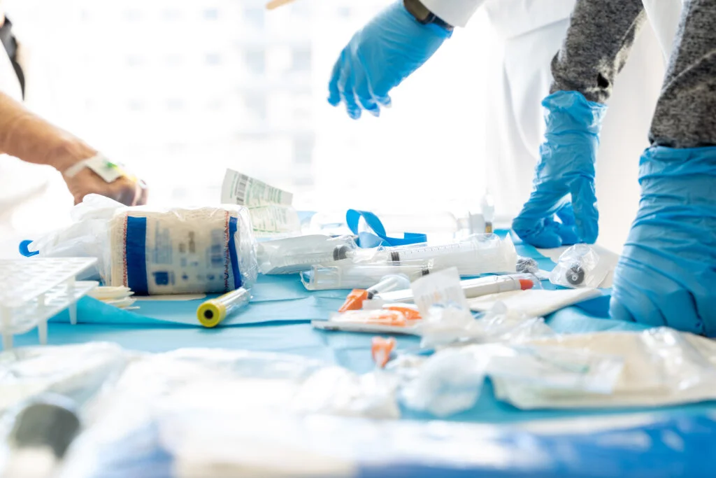 unrecognizable-doctors-at-table-with-medical-equip-2024-12-04-02-43-38-utc-1024x683
